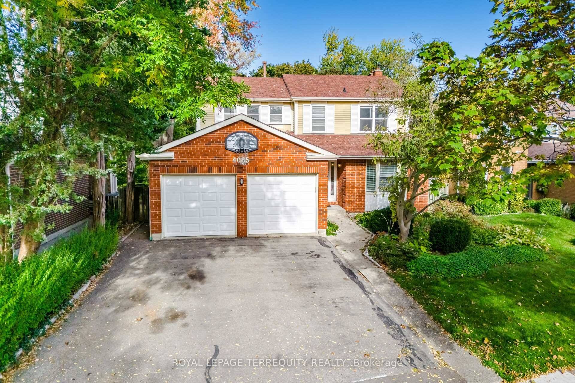 This beautifully maintained family home sits on a private, tree lined lot backing onto serene walking trails.