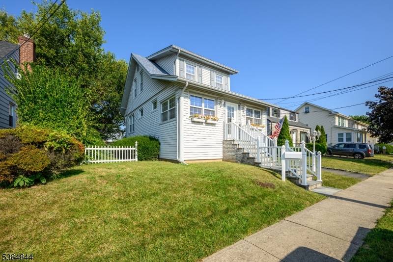 Well maintained two to three bedroom Colonial featuring enclosed front porch with easy care vinyl flooring and decorative fireplace, entry to foyer with access to formal living room with decorative ...