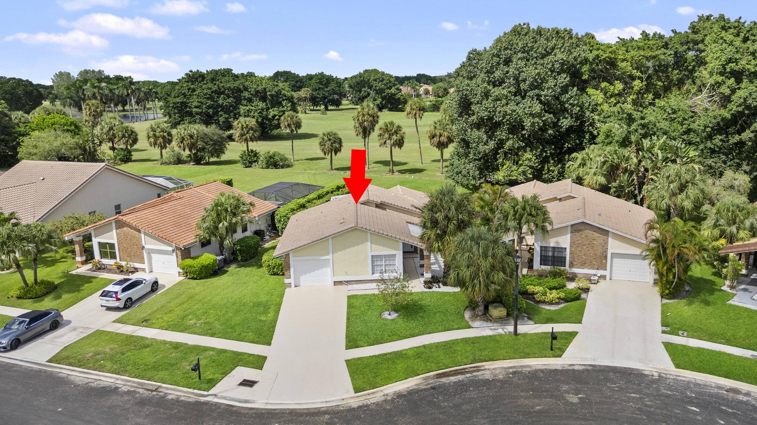 Beautifully updated 3BR 2BA, 1, 716 sq ft home on a private cul de sac in guard gated Boca Greens Country Club.