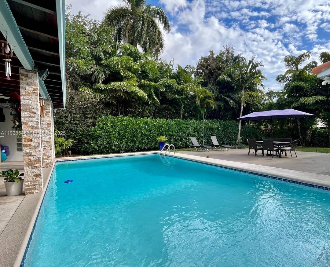 Experience elevated living in this elegant Coral Gables residence featuring a spacious 4 bedroom, 2.