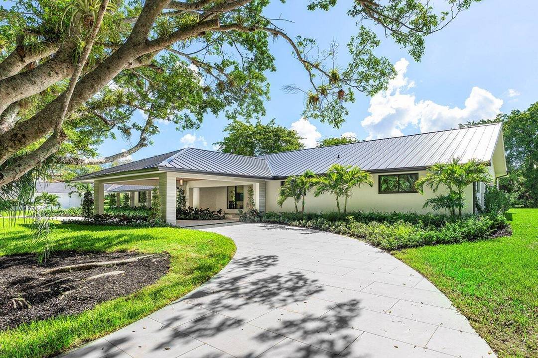 Discover unparalleled luxury and contemporary elegance at 8090 Twin Lake Drive, a meticulously renovated single level estate nestled on a sprawling over one acre lot in the exclusive gated community ...