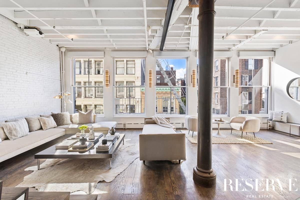 Charming and unique ! Come home to this 2 bedroom, 2 bathroom duplex loft on the quintessential Soho block.