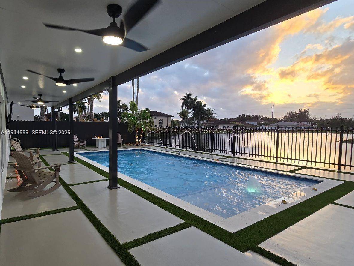 Beautifully updated 4 bedroom, 3 bath modern residence offering porcelain flooring, soaring ceilings, and an expansive open concept kitchen with high end finishes.