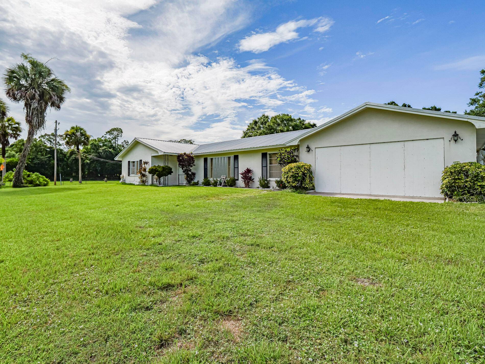 Opportunity to own 10 well tended and fenced acres w updated CBS 3 2 home, 2 newer pole barns, 40x40 and 34X24 2 covered, custom porch areas, shop, greenhouse, irrigated ...
