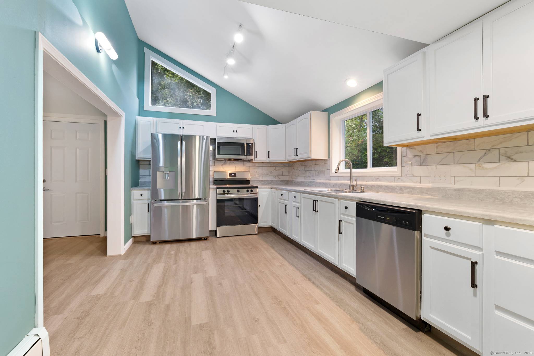 Welcome to 30 Christine Street, a beautifully renovated two family home tucked away on a quiet dead end street in Torrington.