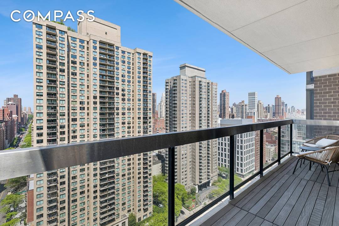 Perched on the 23rd floor, this beautiful corner two bedroom, two bath residence offers sweeping southern and western views, complemented by a private wraparound balcony.