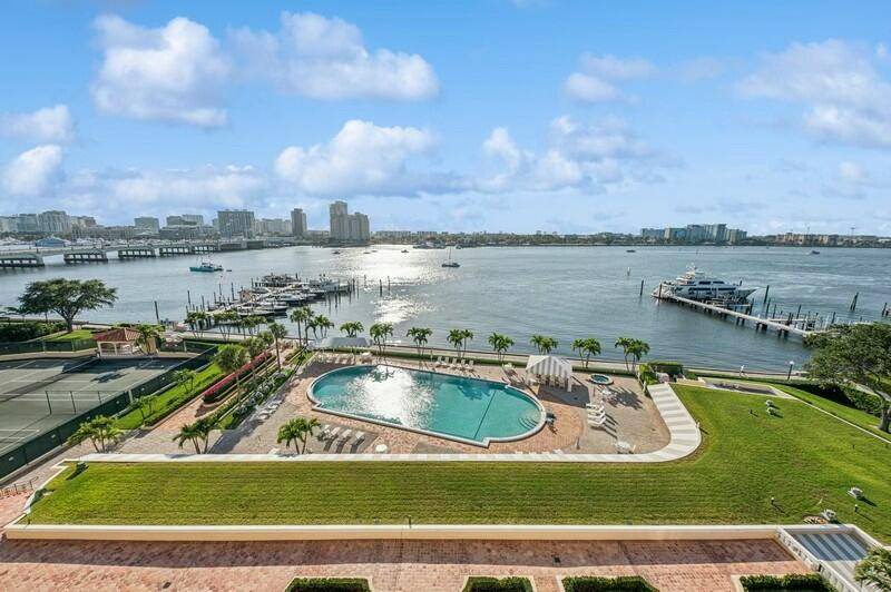 This spacious over 1800 sf residence at the iconic PB Biltmore offers sweeping views of the Intracoastal Waterway lush courtyard gardens.