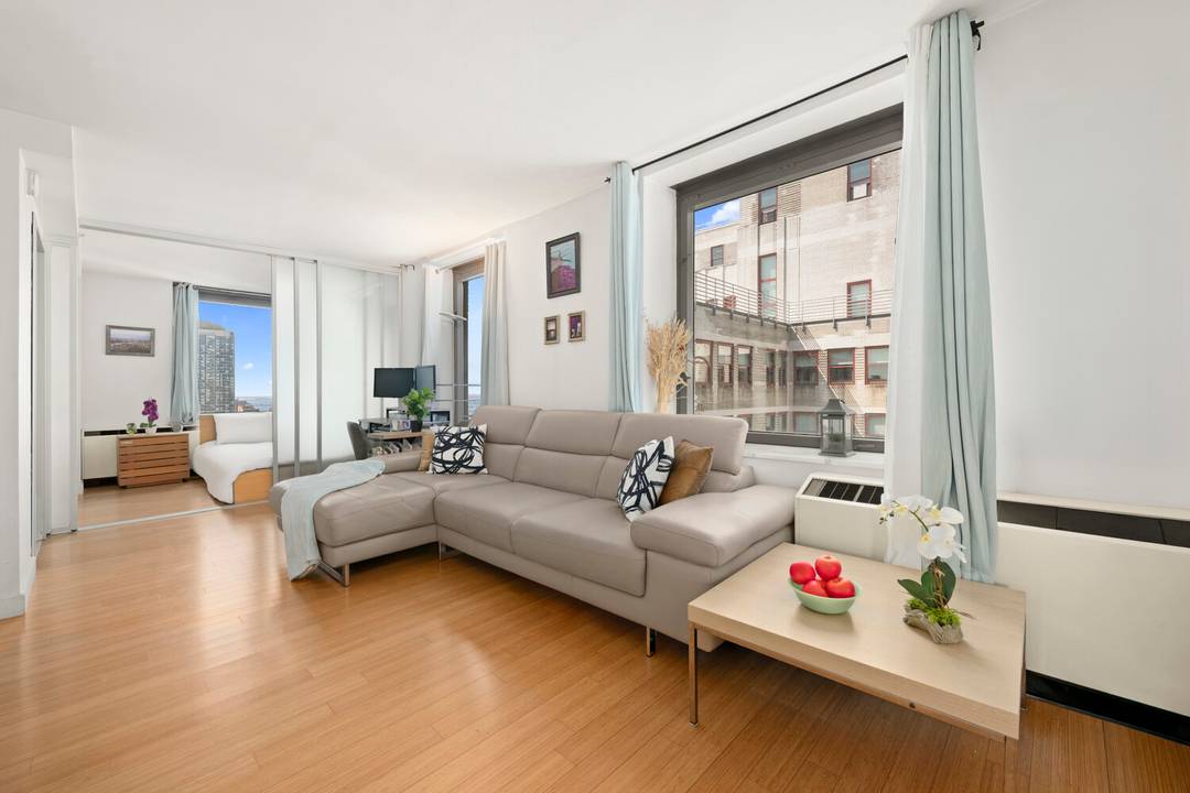 Wake up to postcard perfect views of the city from this modern Midtown condo.