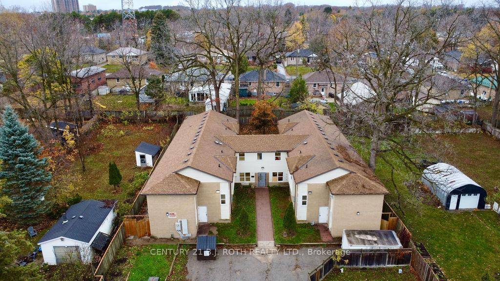 43 bedroom rooming house with 2 huge kitchens on a large property with ample parking.