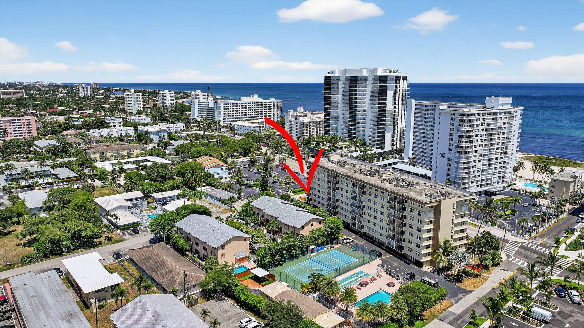 Welcome to this beautifully updated 2 bedroom, 2 bath corner unit located right across the street from the beach.