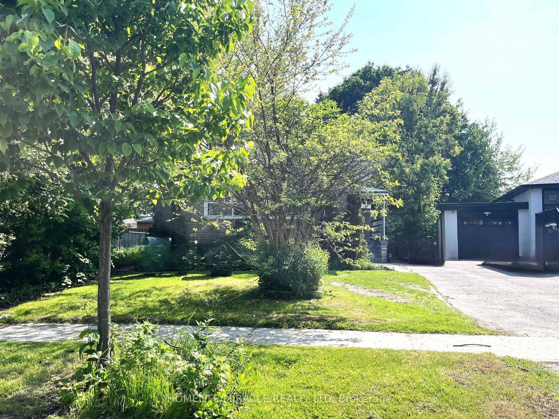 A charming 4 bedroom detached bungalow offers a bright, open concept living and dining area with large windows that flood the space with natural light.