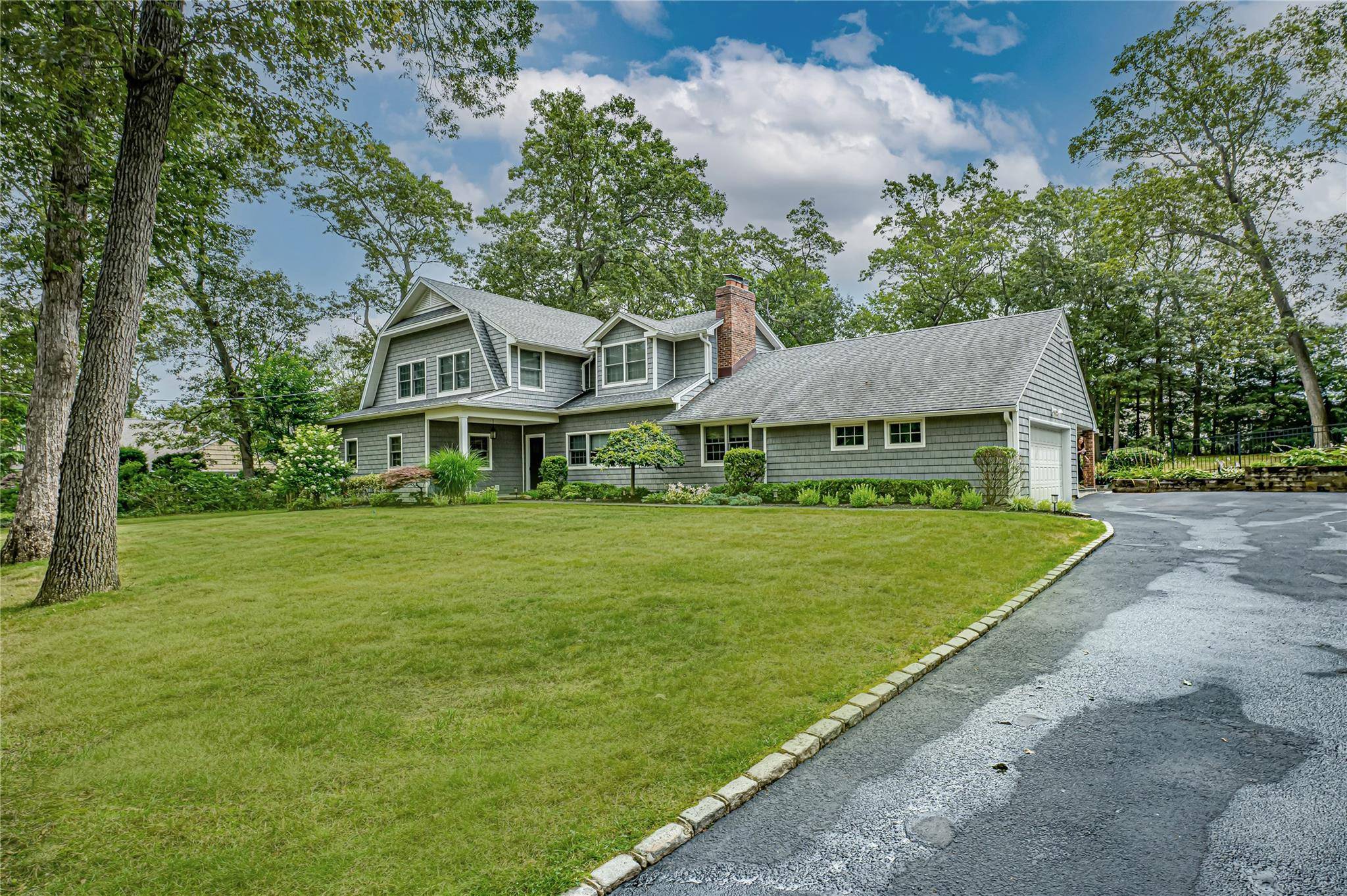 Renovated 6 Bedroom Hampton Style Home in The Gates of Woodbury Turnkey living awaits at this stunning, recently renovated 6 bedroom, 3.