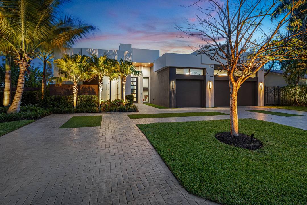 Chic, Modern Residence artfully crafted by award winning Albanese Home Builders, sited on an oversized corner lot in sought after Lighthouse Point.