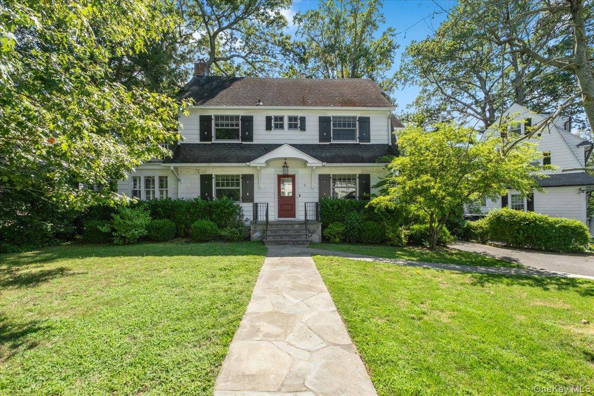 Freshly repainted Greenacres Colonial home set on a tranquil street with a short walk to Greenacres Elementary School and Hartsdale train station and village.