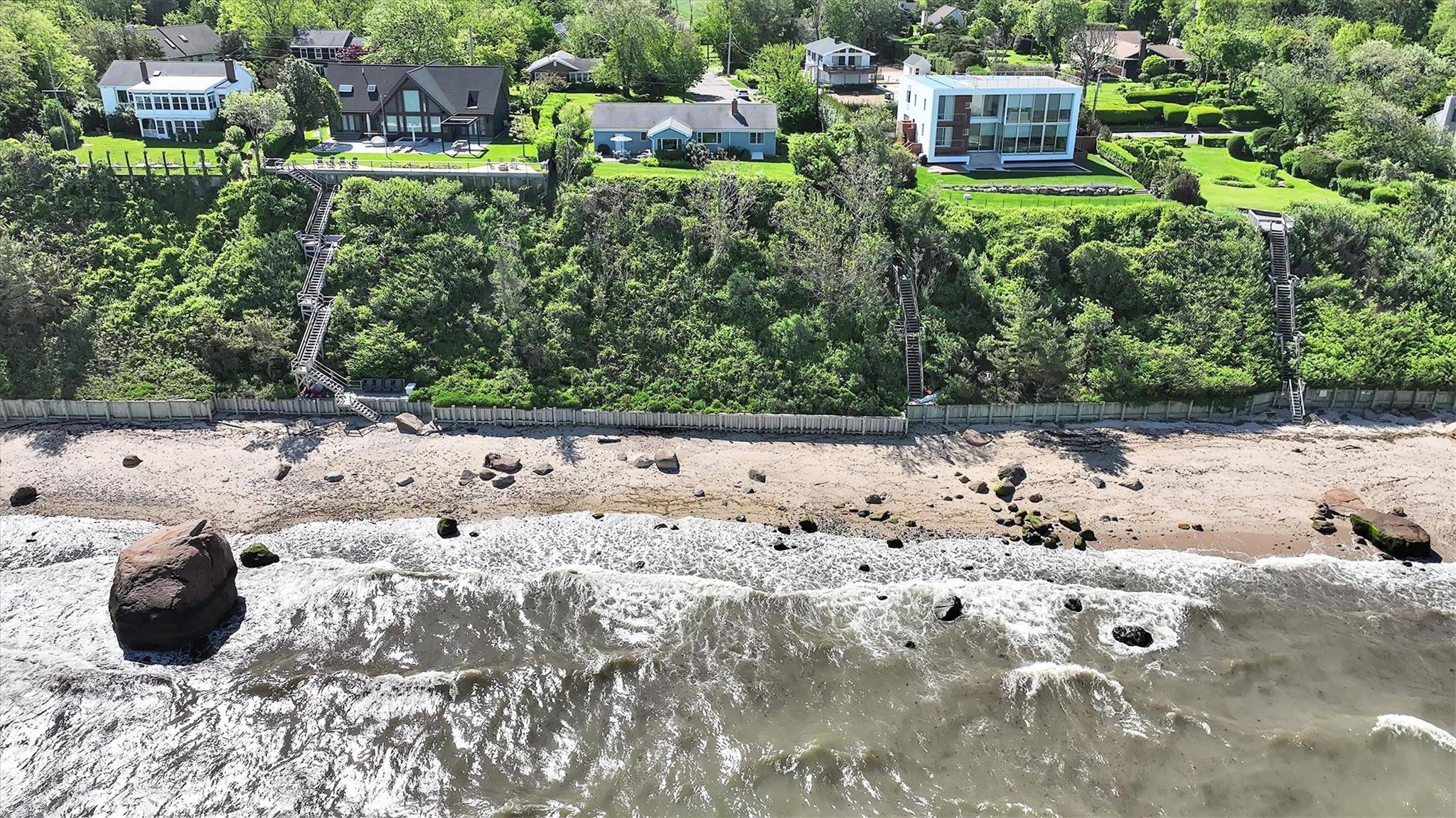 Enjoy panoramic views and unforgettable sunsets from this charming soundfront retreat in Cutchogue.