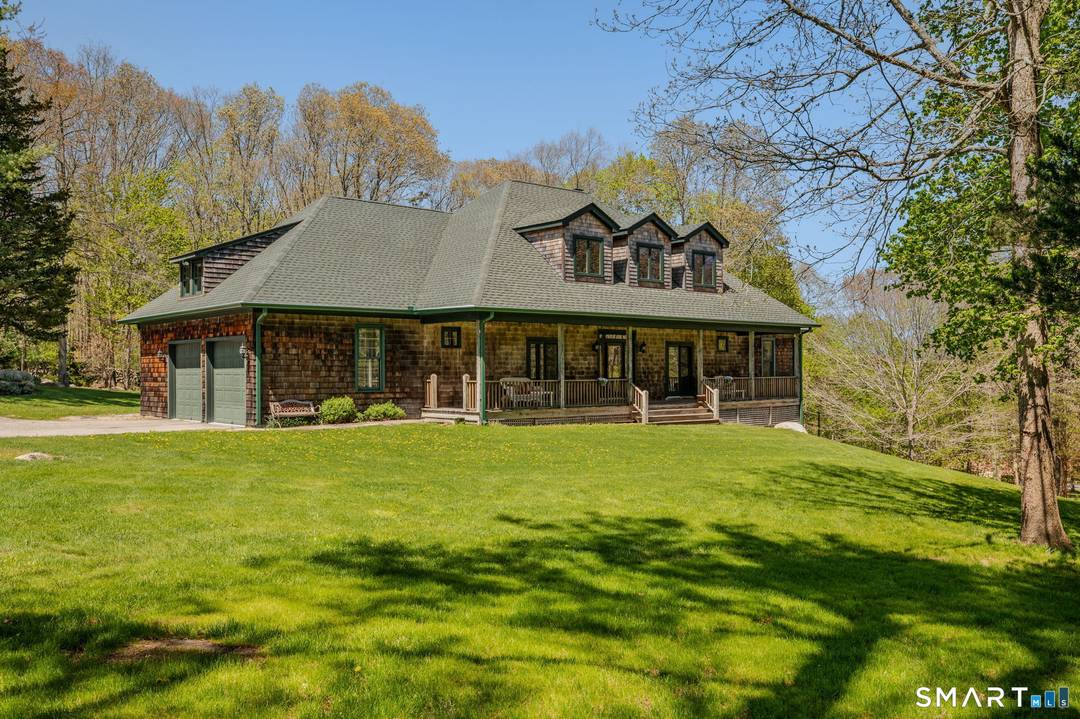On 4 private acres sits a beautiful 3 level custom built home with front and back covered porches and an additional dwelling unit ADU.