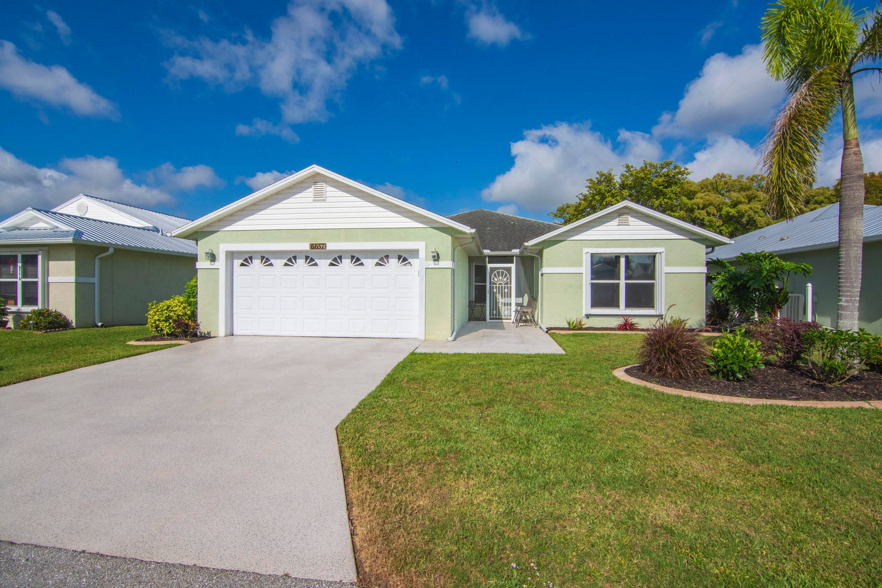 Sunsets are Magical at this Contemporary 3 bedroom lake view home in vibrant 55 community on leased land 802.