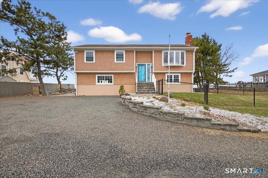 Waterfront on Morgan Point with 125' private sandy beach and southeast exposure, offering sweeping Long Island Sound views and beautiful morning light.