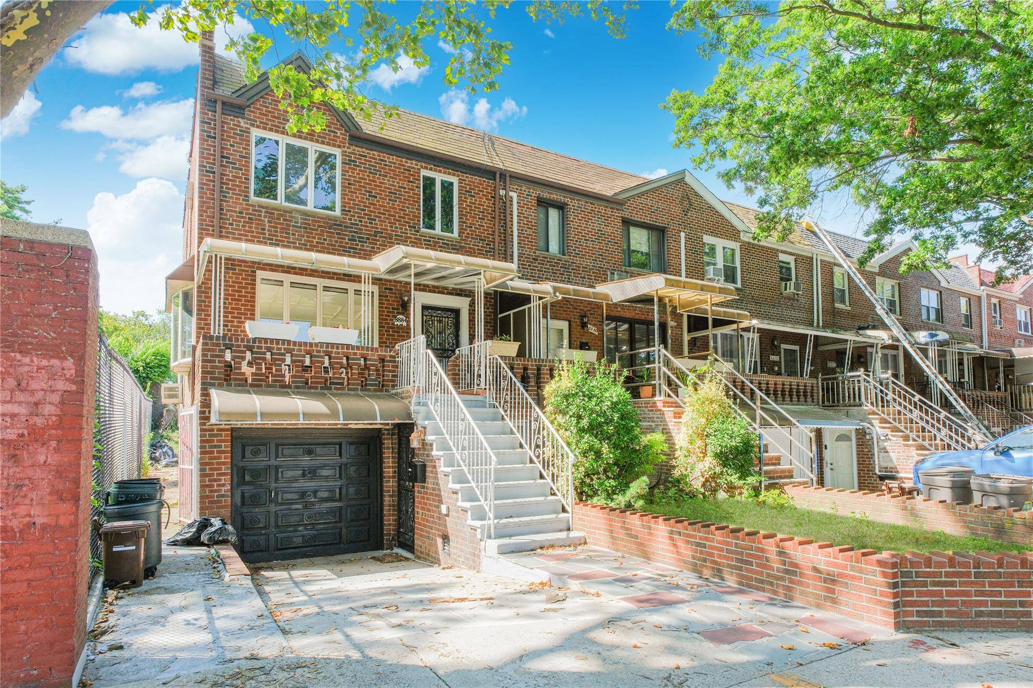 Two family end unit townhouse that's semi attached Gravesend Park water views in fall and winter from main unit.