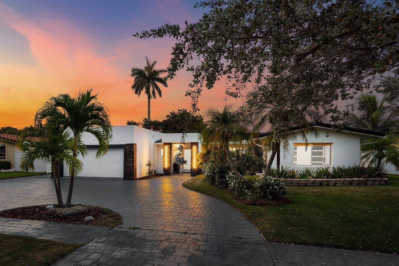 Just 5 minutes from the beach, this sleek 4BD 3BA home blends modern design with coastal charm.