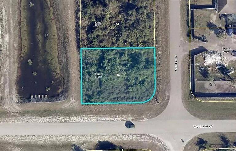 This corner lot with canal in the back is located in a quiet neighborhood on Jaguar Blvd with easy access to SR82.