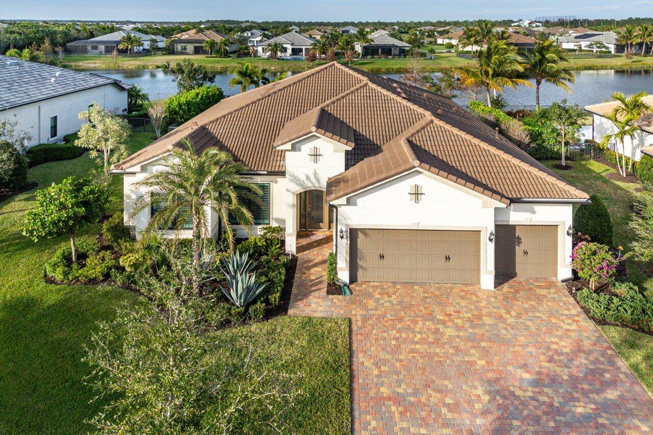 Buyer's Agents Welcome ! Waterfront 4 Bedroom, 3 Full Bath Home Located in the Beautiful 97 Home Gated Community Of Ancient Tree in Palm Beach Gardens.