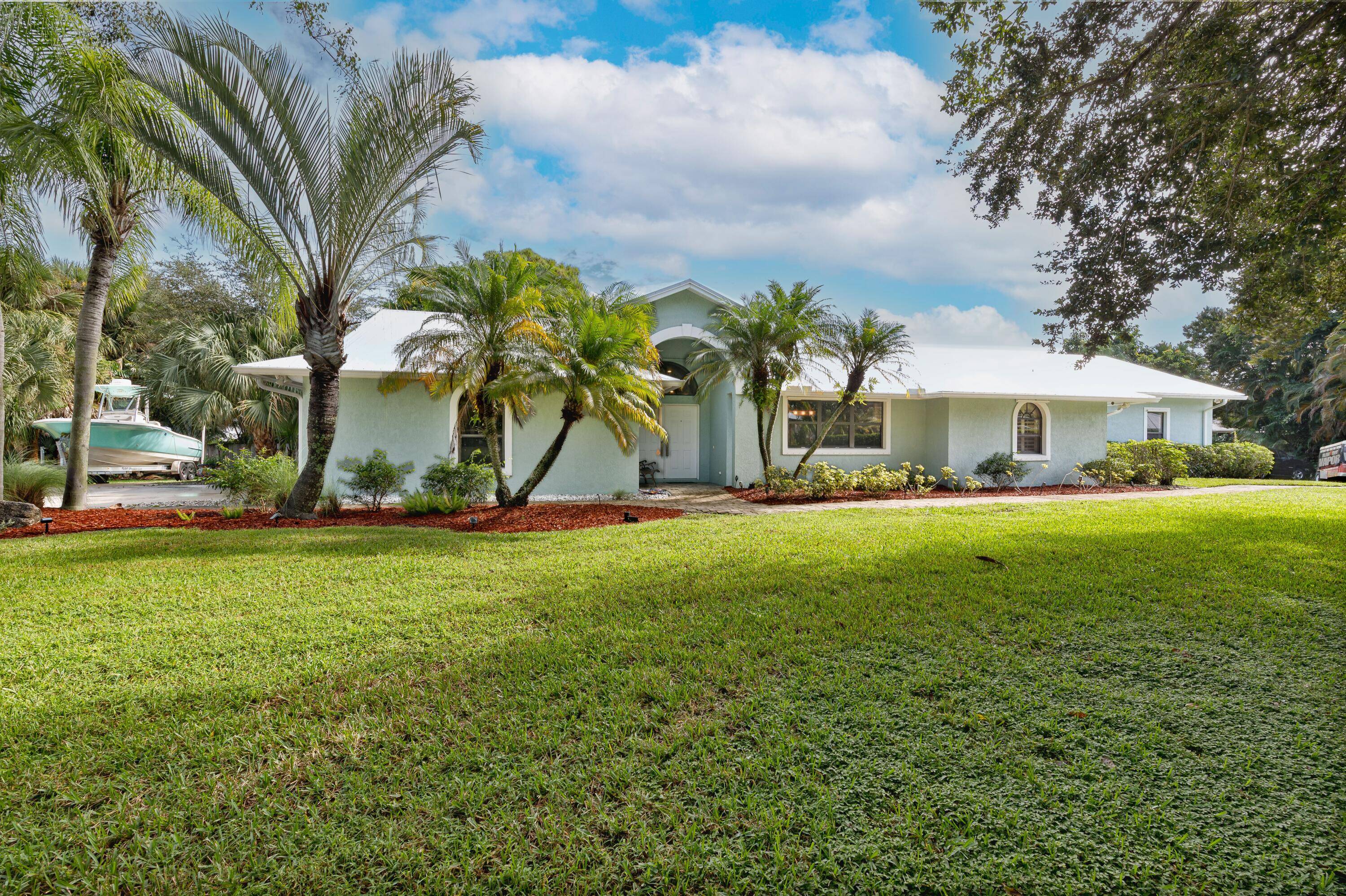 Don't miss the chance to own this charming 4 bedroom home nestled in the peaceful cul de sac of Magnolia Bluff in Palm City.