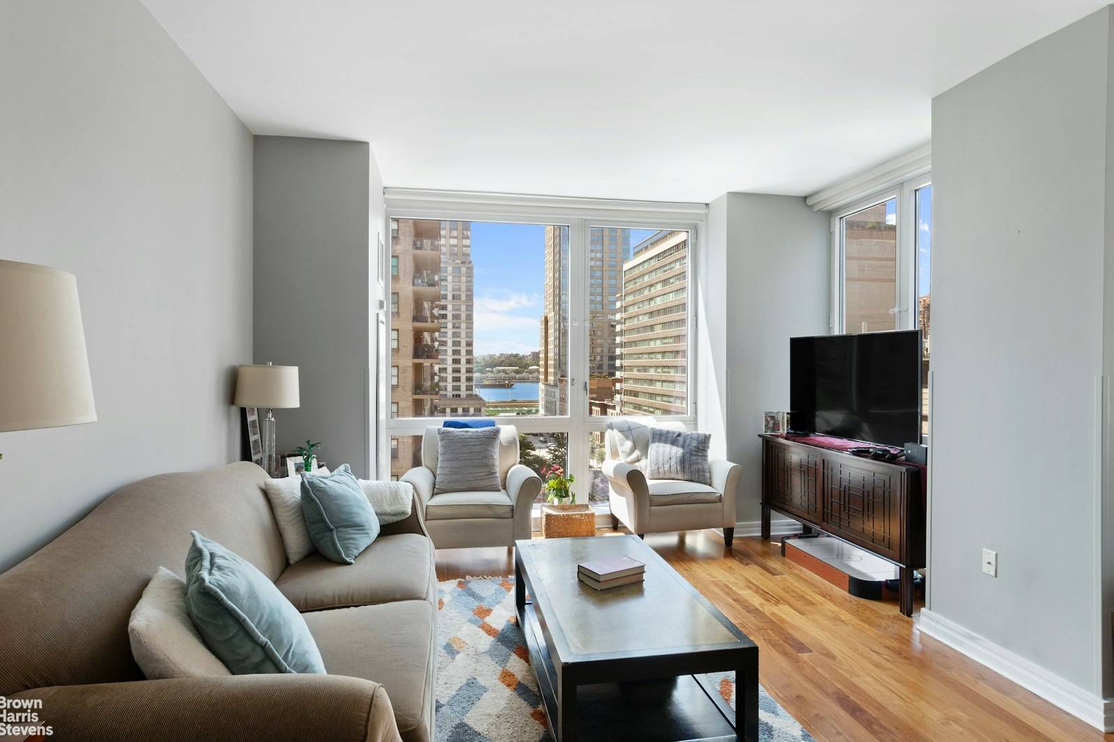 BRIGHT CORNER UNIT WITH RIVER VIEWS !
