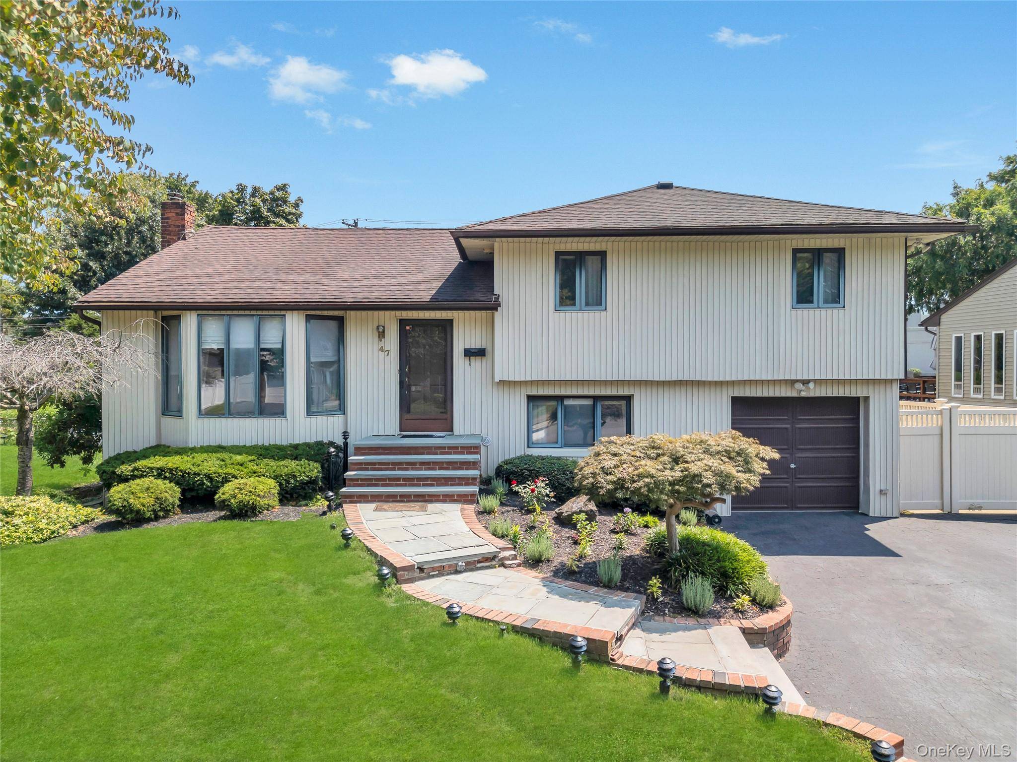 Welcome to this beautifully maintained split level home, set on a professionally landscaped lot in a highly sought after neighborhood.