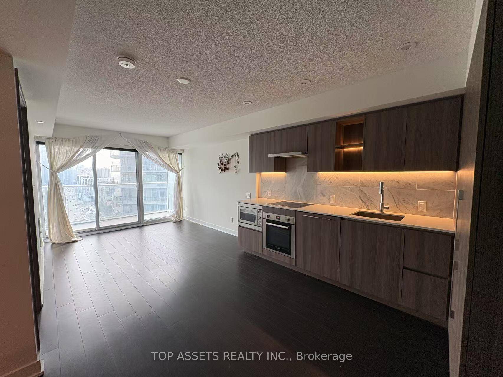Experience luxury downtown living in this impeccably furnished 1 Bedroom Den condo, featuring high ceilings, premium finishes, laminate flooring throughout, and floor to ceiling windows offering breathtaking views of the ...