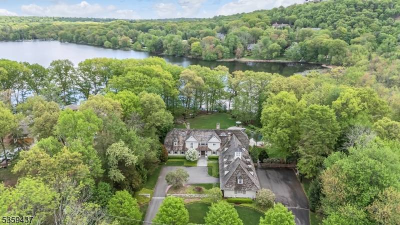 Experience elegance and comfort in this stunning 7, 823 square foot custom built estate, perfectly positioned on two acres of lakefront property.