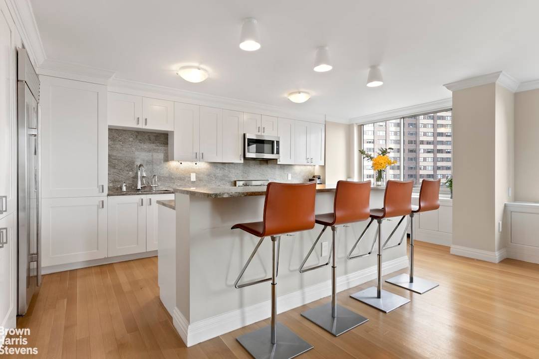 Sun Filled Corner Residence Just a Half Block from Central Park This spacious, beautifully renovated three bedroom, three and a half bathroom home offers the perfect blend of elegance and ...