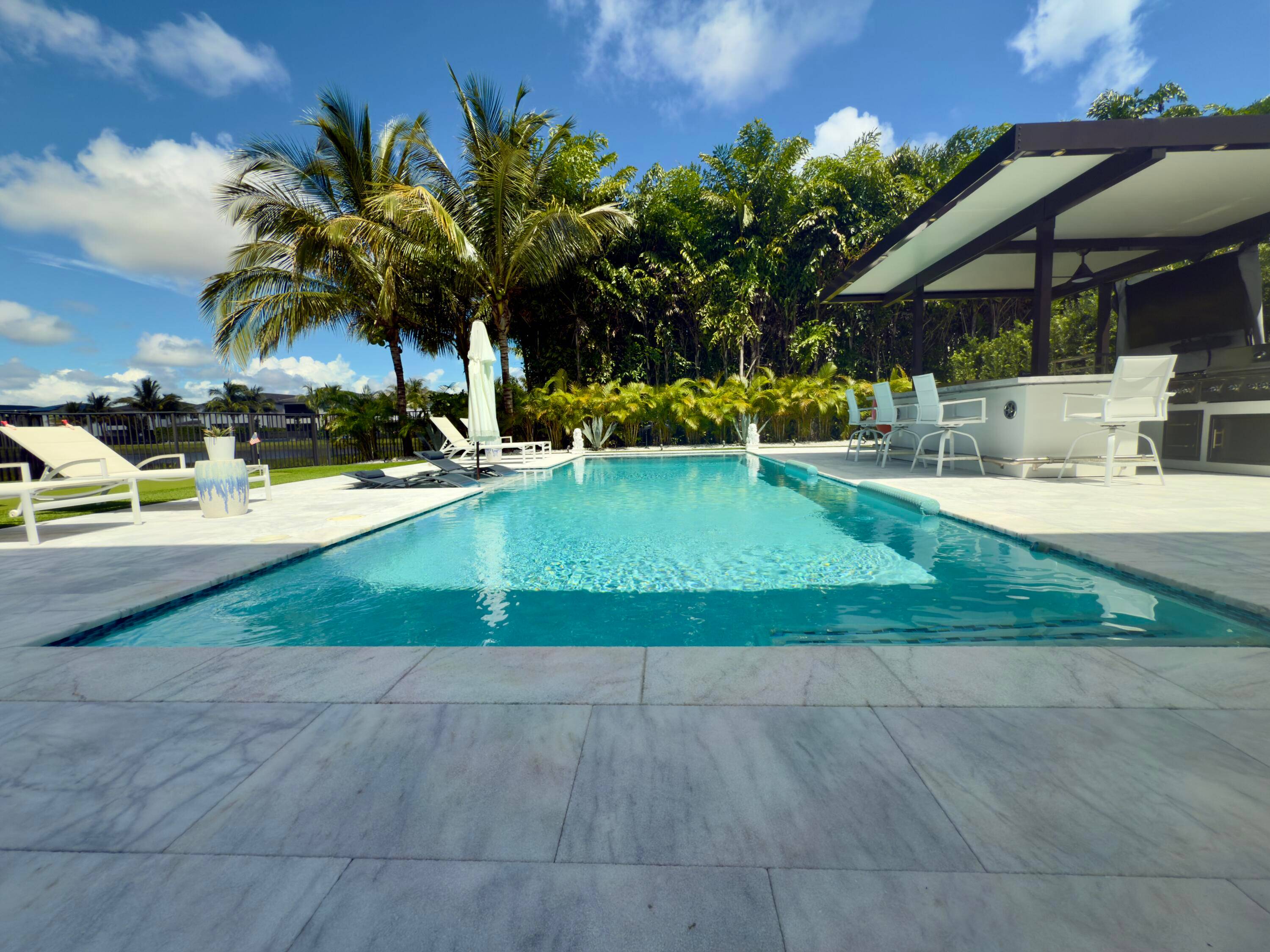 This one of a kind Polynesia model in Lotus showcases extensive custom upgrades and a showstopping outdoor oasis.