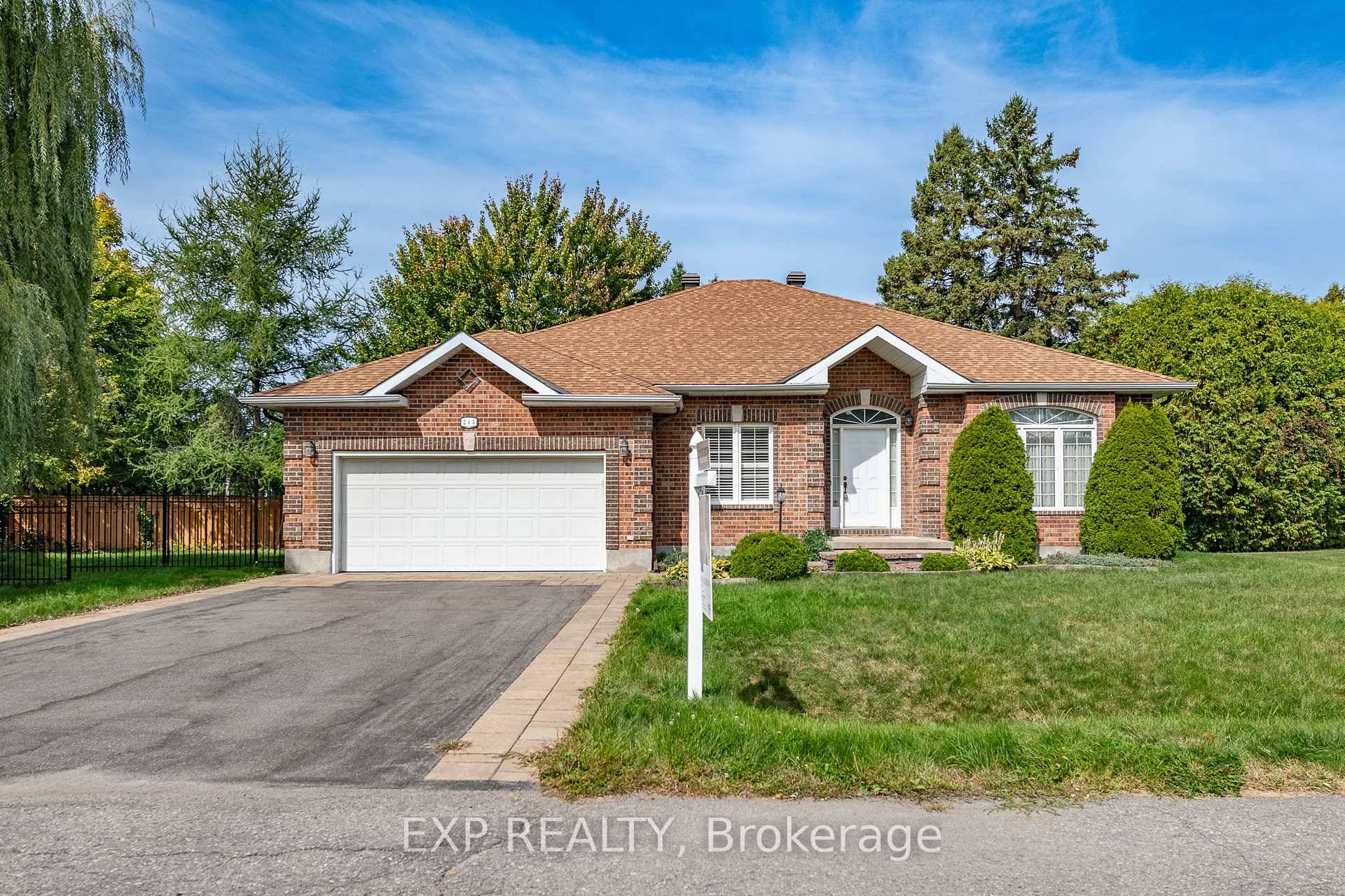 CUSTOM ALL BRICK BUNGALOW IN THE HIGHLY SOUGHT AFTER REVELSTOKE COMMUNITY, FEATURING 3 BEDROOMS, 3.