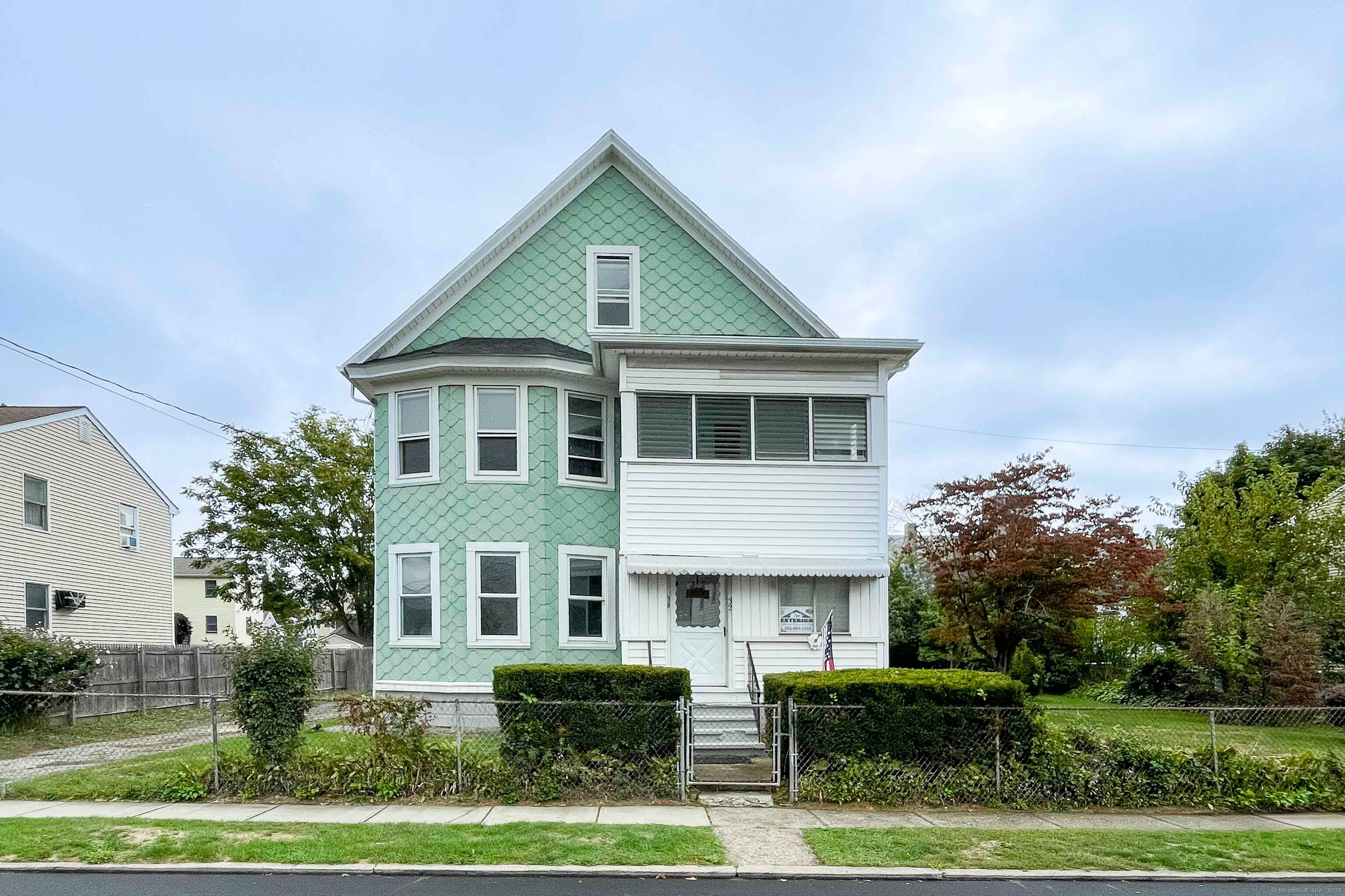 Beautiful well maintained two family with a double sized lot !