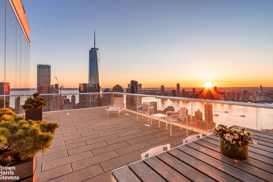 This exceptional and breathtaking 5, 200 square foot condominium residence, with soaring 14 ft.