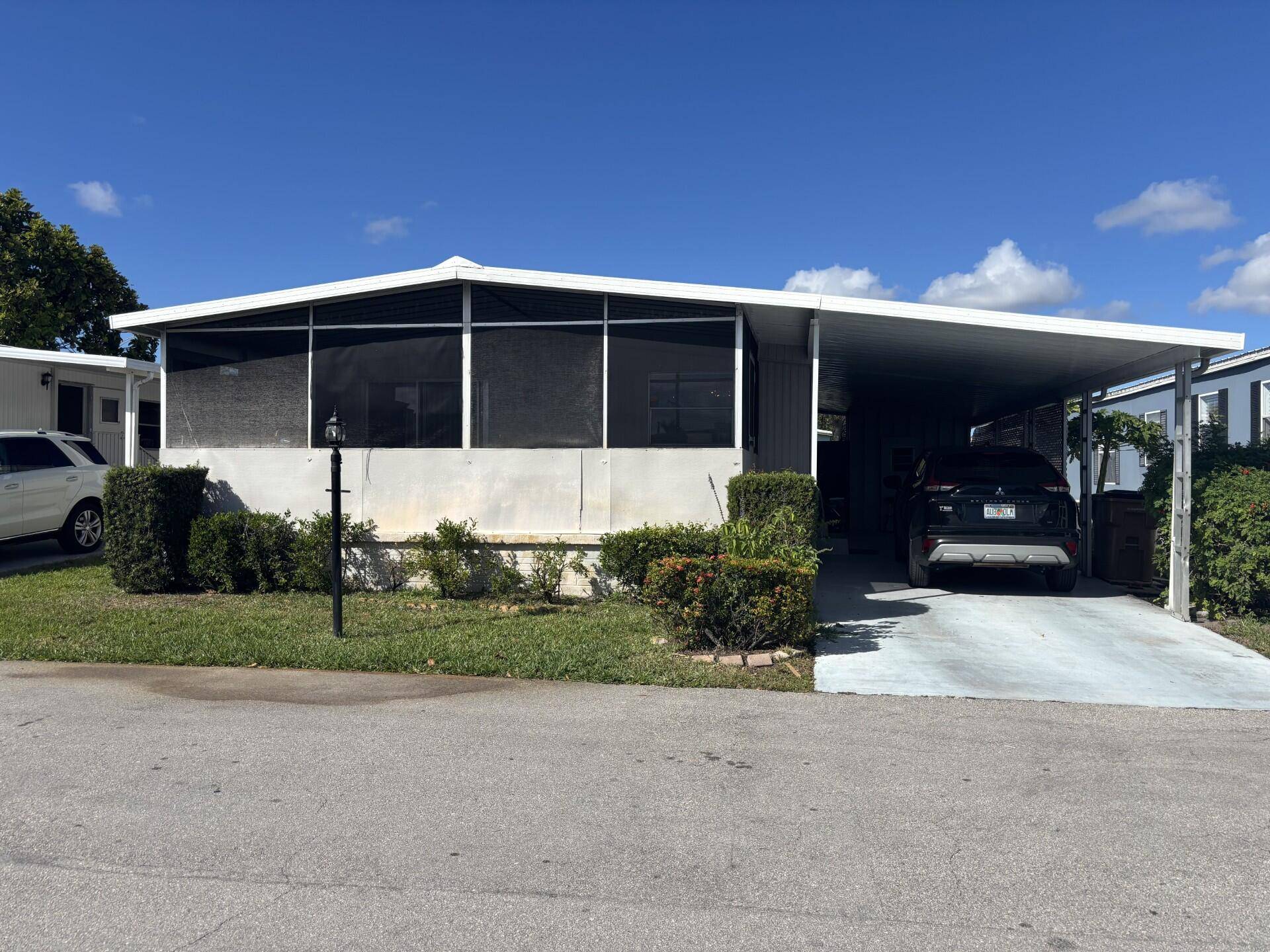 DON'T MISS THE OPPORTUNITY TO VIEW THIS SPACIOUS 2 BEDROOM 2 BATH HOME, AT TIDEWATER ESTATES, A QUIET 55 COMMUNITY, ONLY 3 MILES FROM DESIRABLE DEERFIELD BEACH !