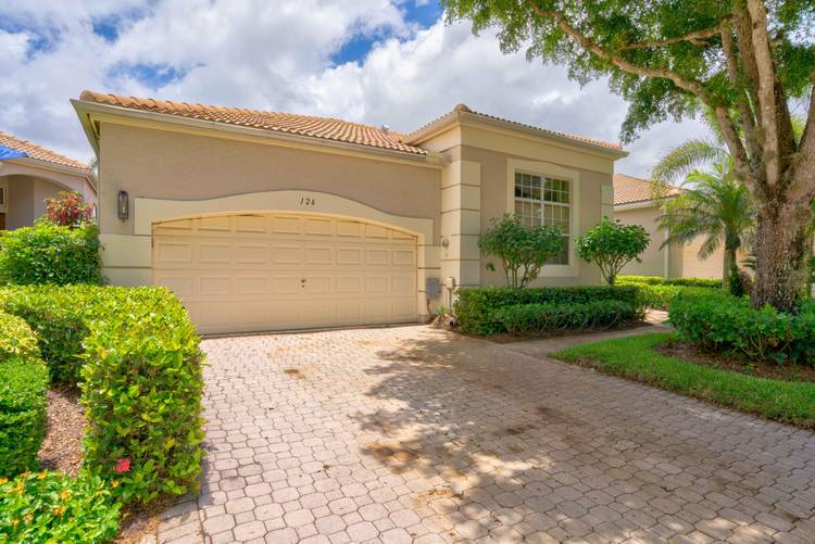 Welcome to 126 Sunset Bay Drive, where this Ballenisles home not only graces you with breathtaking sunset views but also offers a spacious haven.
