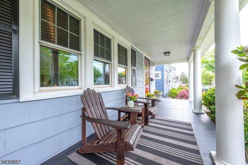 Picture perfect Oakview section Colonial on tree lined street with inviting lemonade porch.