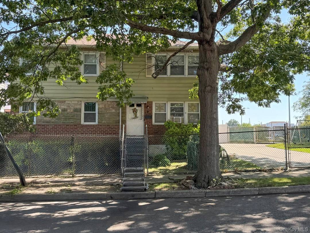 Well maintained two family brick and vinyl sided property situated on an oversized, highly desirable corner lot in the heart of South Ozone Park.