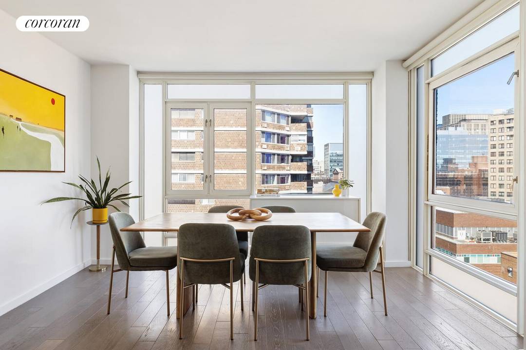 Enjoy exceptional natural light from oversized windows in this river facing corner two bedroom, two bathroom condominium home, where serene water views and vibrant city energy define the living experience.