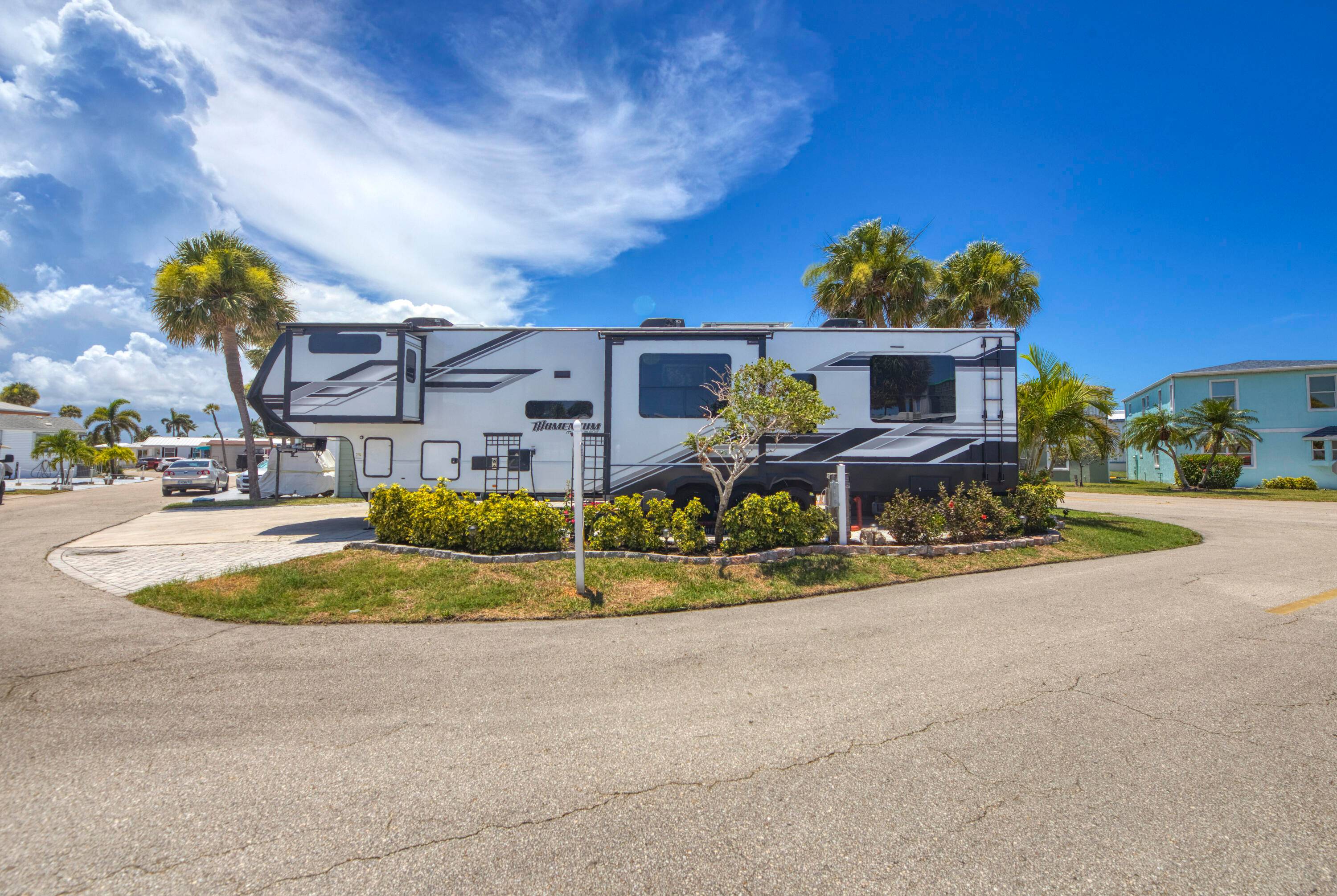 Charming property located on oversized, professionally landscaped corner lot in Nettles Island steps away f the beach manned guard gate.