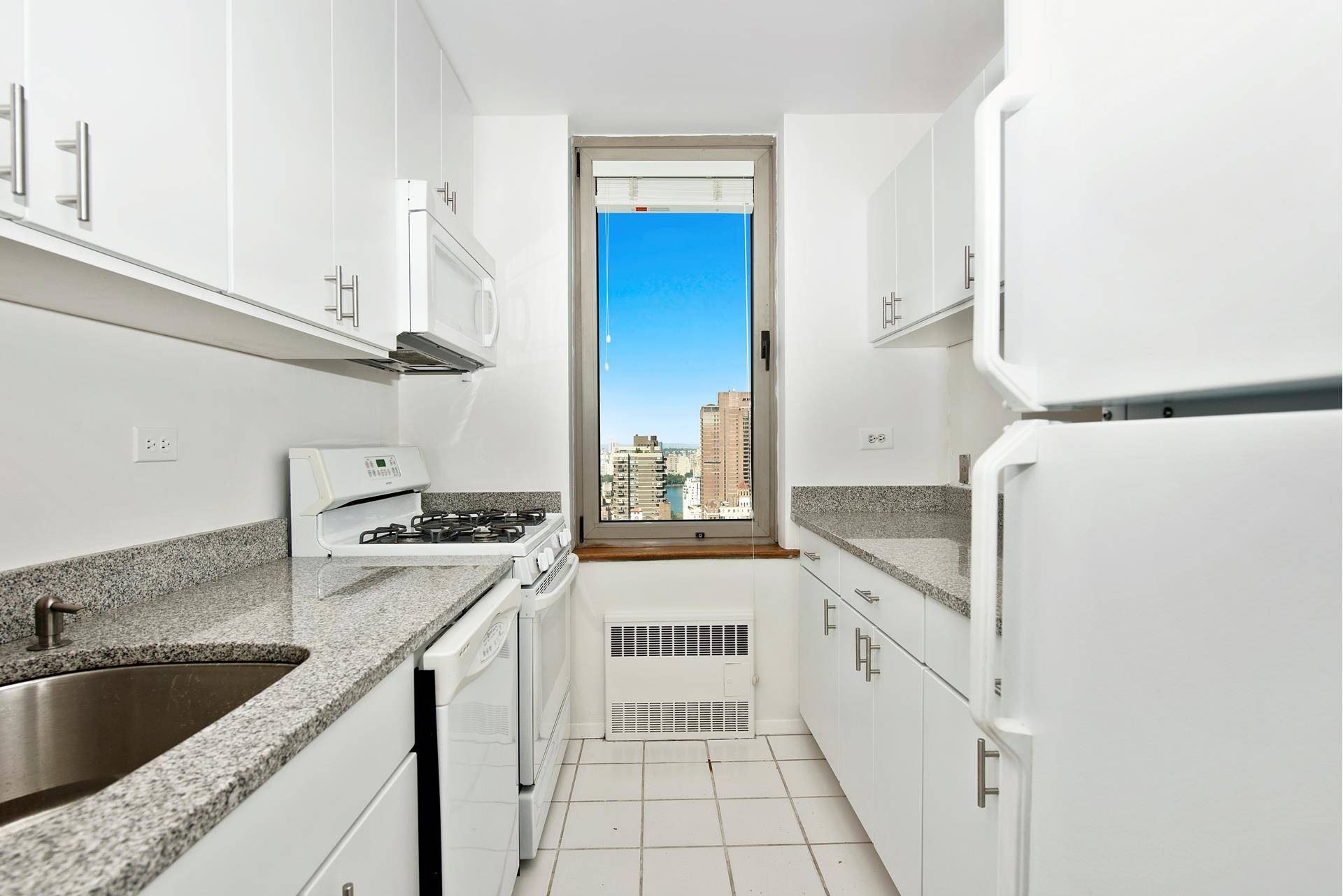 This one of a kind 36th floor corner apartment boasts panoramic views of the Central Park Reservoir, New York City, East River and Bridges.