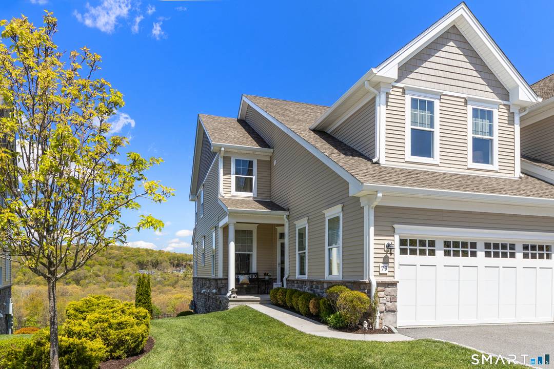 Panoramic mountain views highlight this Denton end unit in the prestigious Ridge section of Rivington.