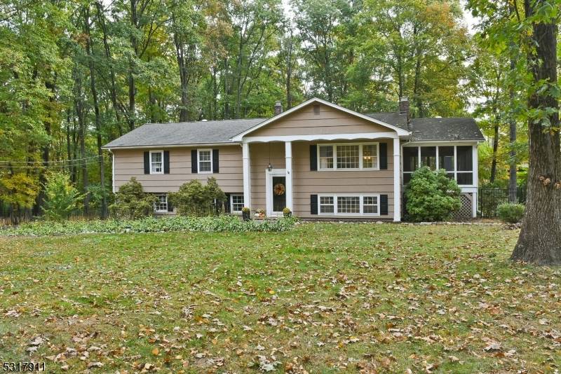 Pristine home on a 2 acre lot within the quiet serenity of Chester Twp.