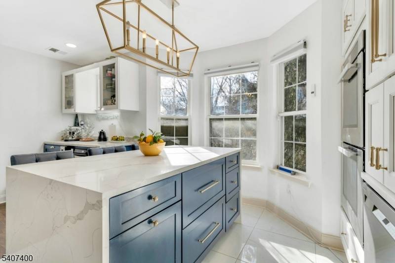 Welcome to this beautifully maintained 2 bed, 2 bath with a den in the highly desirable Country Woods community of East Brunswick.