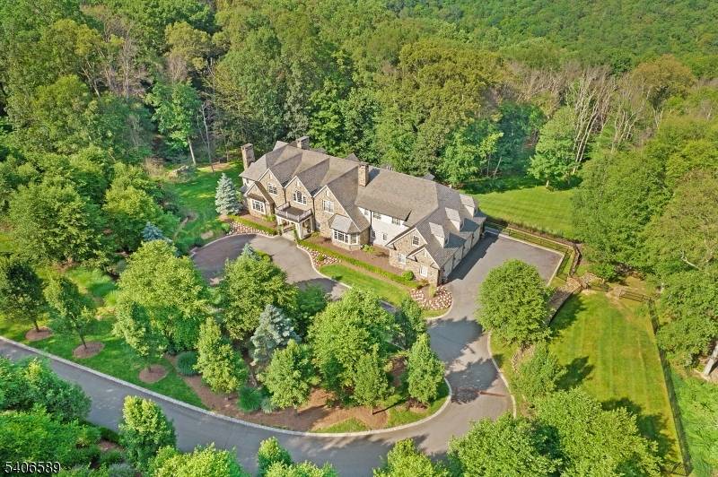 Absolutely stunning stone front Manor House perfectly embodies the joy of graceful living with 9, 125 sq.