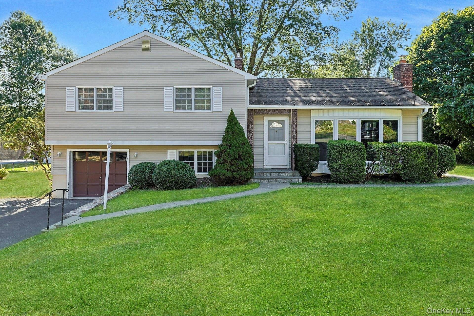 Set back on nearly half an acre of private, level property, this well cared for 3 bedroom split level home offers space, comfort, and tremendous potential.