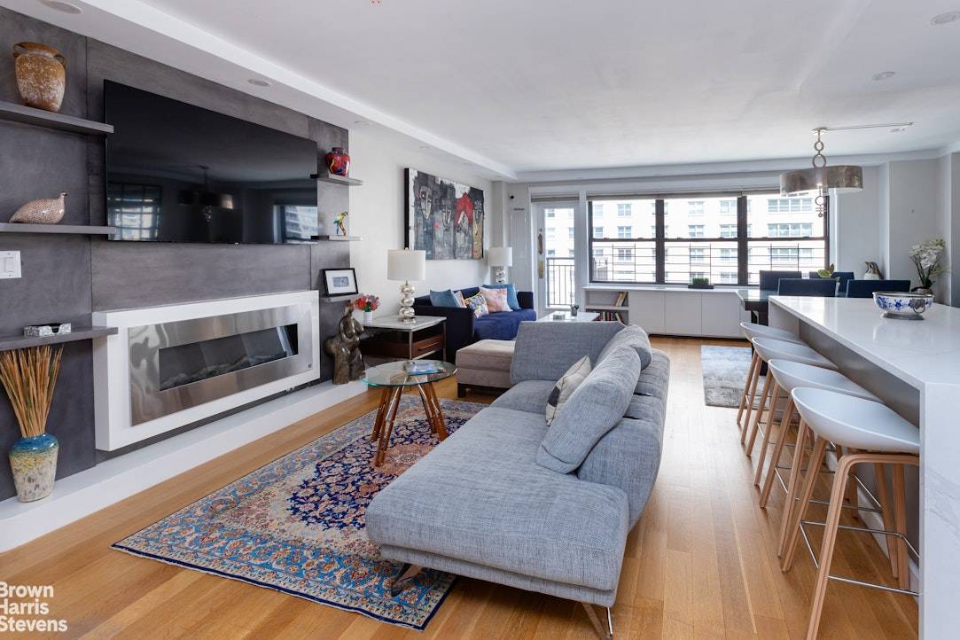 Spectacular Renovated 5 Room Home with Office Media Room This stunning high floor corner residence offers open city and river views along with a spacious balcony for indoor outdoor living.