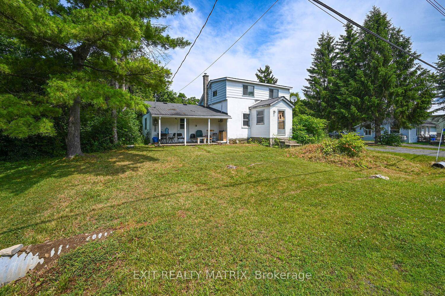 This 2 storey home with a detached two car garage offers potential for renovation or redevelopment.